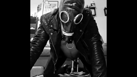 Leather and rubber slave loses virginity to a machine